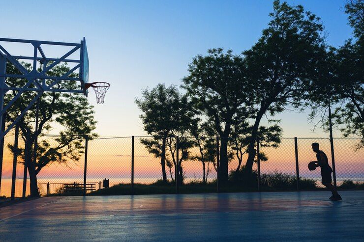 black man doing sports playing basketball sunrise silhouette 285396 1445